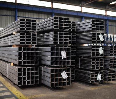 A closeup of stacked Profile Pipes in a factory